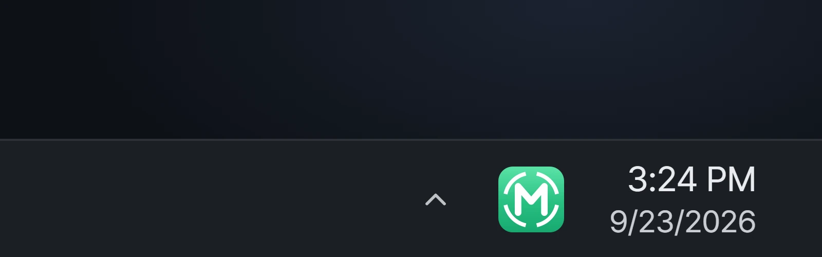 A dark taskbar, zoomed in, with a single M icon next to the clock